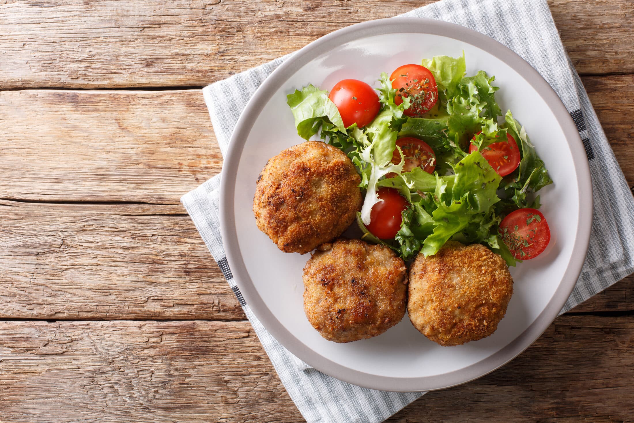 Tasty Danish Pork Minced Meat Patties In Breading With Fresh Veg